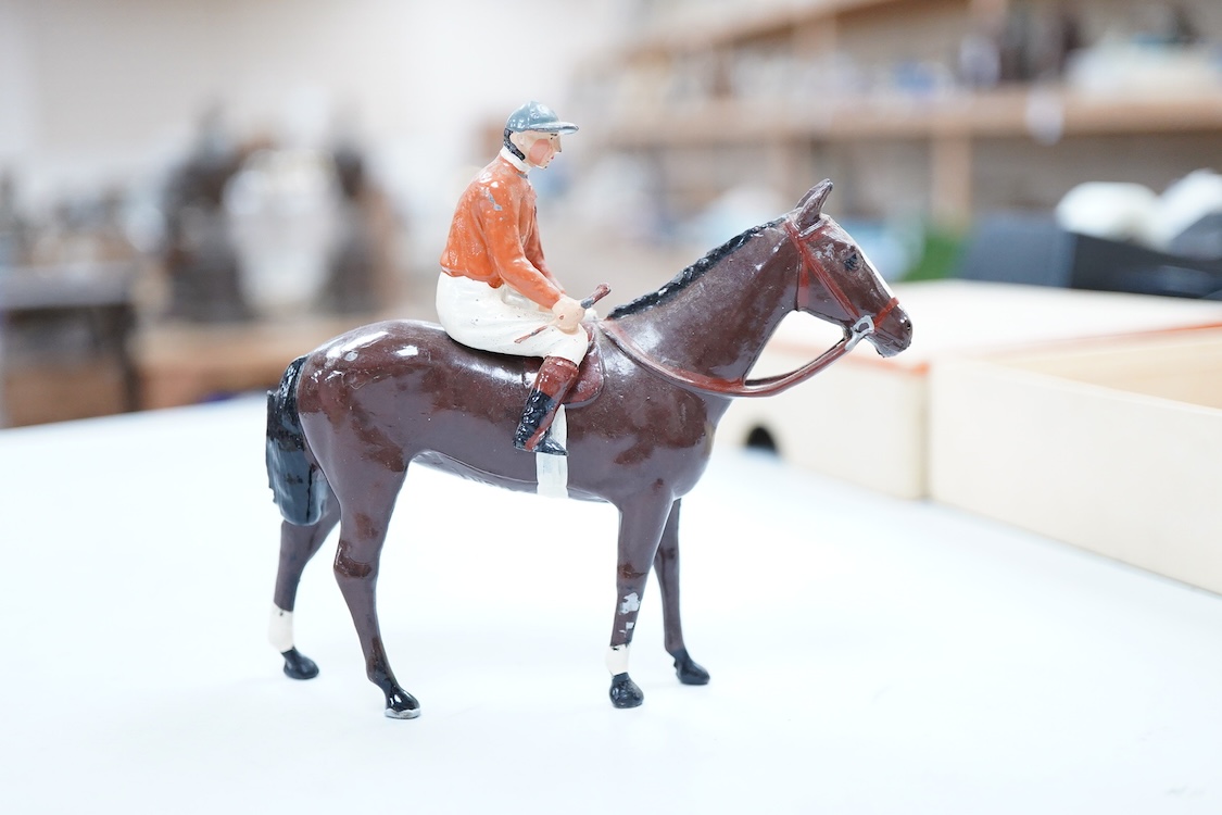Two boxed Britains Racing Colours of Famous Owners series lead mounted figures; Miss Dorothy Paget - rider in yellow-striped blue jersey on a grey horse, and Msr. M. Boussac - rider in orange jersey on a dark brown horse